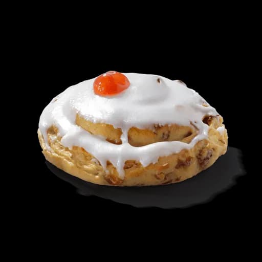 Traditional iced Belgian bun topped with glacé cherry
